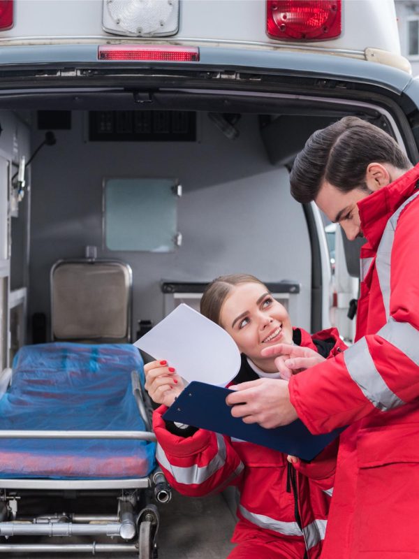 happy-male-and-female-paramedics-reading-documents-2023-11-27-05-22-15-utc (1)