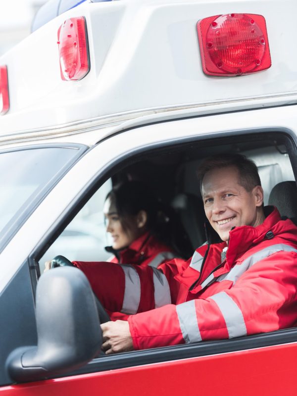 happy-male-and-female-paramedics-sitting-in-ambula-2023-11-27-05-24-39-utc (1)